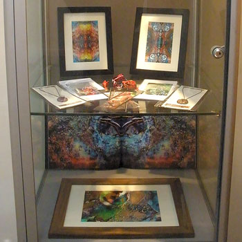 Glass cabinet image from London Exhibits with freelance artist Brenda Coyle